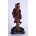 A 19TH CENTURY CHINESE CARVED HARDWOOD FIGURE OF A FISHERMAN Qing. 17 cm high.