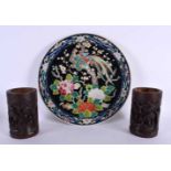 A JAPANESE TAISHO PERIOD FAMILLE NOIRE PORCELAIN PLATE together with two bamboo brush pots.