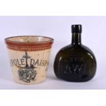 A CHARMING ANTIQUE MAYPOLE DAIRY POTTERY MEASURE together with a Victorian AW glass bottle.