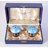 A PAIR OF ART DECO SILVER AND ENAMEL MUSHROOM CONDIMENTS. 50 grams. 4.25 cm x 3.5 cm.