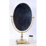 A gilt metal dressing table mirror 57 x 35 cm.