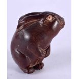 A JAPANESE CARVED BONE HARE NETSUKE. 5 cm x 3 cm.