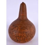 AN ANTIQUE CONTINENTAL CARVED AND ENGRAVED GOURD NUT. 14 cm x 7 cm.