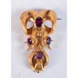 A VICTORIAN YELLOW METAL AND AMETHYST BROOCH. 9.8 grams. 6 cm x 3.25 cm.