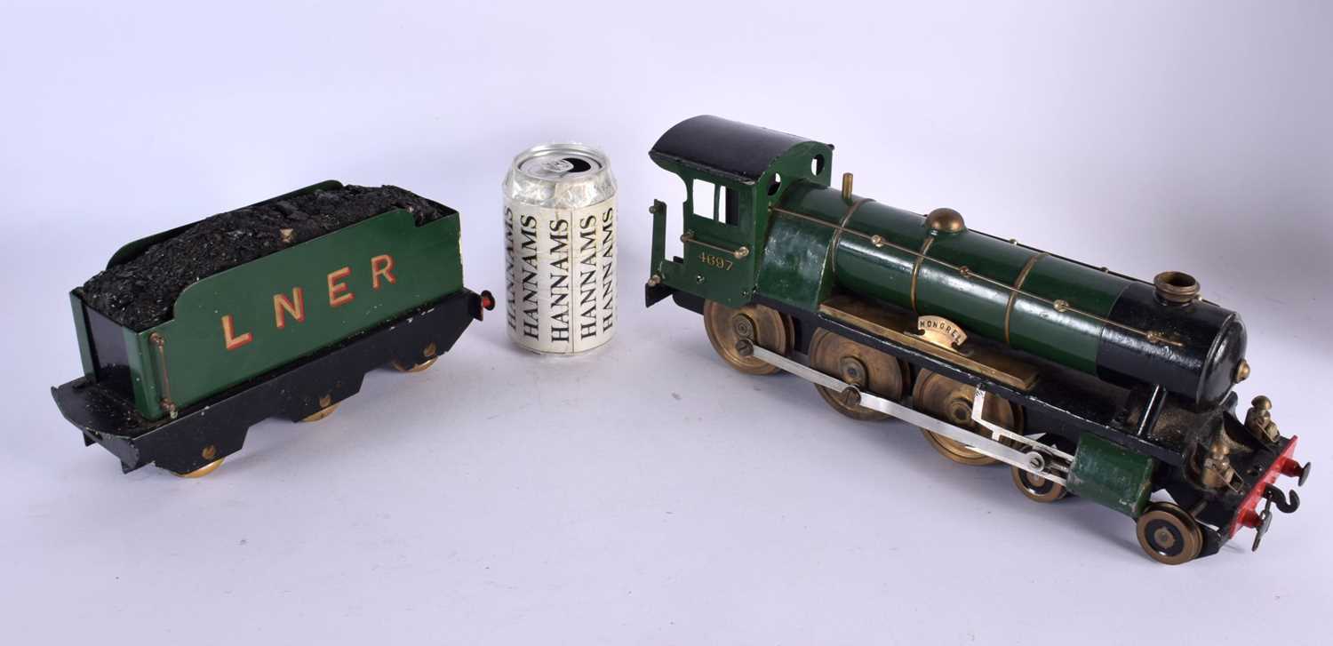 A SCRATCH BUILT LOCOMOTIVE TRAIN AND TENDER Mongrel, No 4697. 56 cm long inc tender. (2)