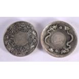 A PAIR OF CHINESE WHITE METAL COIN DISHES 20th Century. 213 grams. 9 cm diameter.