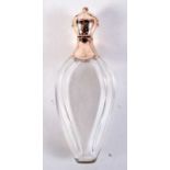 AN 18CT GOLD TOPPED CRYSTAL GLASS SCENT BOTTLE. 48 grams. 10 cm high.