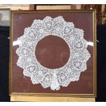A large framed antique lace collar. 70 x 70cm.