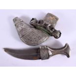 A 19TH CENTURY MIDDLE EASTERN OMANI SILVER MOUNTED RHINOCEROS HORN JAMBIYA DAGGER with elaborate