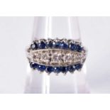 A 14CT GOLD DIAMOND AND SAPPHIRE RING. 4.1 grams. L/M.