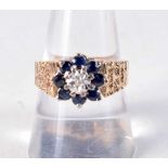 A 9CT GOLD DIAMOND AND SAPPHIRE RING. Q. 5.2 grams.