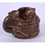 A JAPANESE CARVED BOXWOOD TOAD AND BASKET NETSUKE. 5 cm x 3 cm.