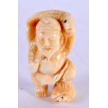 A JAPANESE CARVED BONE FISHERMAN OKIMONO. 5 cm x 3 cm.