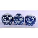 THREE 19TH CENTURY CHINESE BLUE AND WHITE GINGER JARS Qing, two with covers. Largest 15 cm x 10