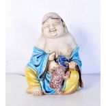 A Chinese Fahua porcelain figure of buddha, formed seated. 20 cm high.
