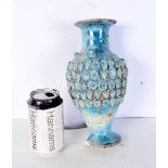 An Islamic blue glazed pottery vase. 25.5 cm.