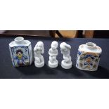 TWO FAIENCE JARS and three figures. 12 cm x 9 cm. (5)