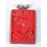 A TIBETAN CINNABAR LACQUER PENDANT. 63 grams. 9.5 cm x 6 cm.