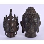 A 19TH CENTURY CHINESE TIBETAN BRONZE BUDDHA HEAD together with a similar bronze head. Largest 10 cm