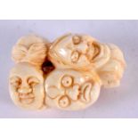 A JAPANESE CARVED BONE MASK NETSUKE. 5 cm x 3 cm.