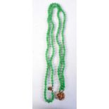 A 14CT GOLD DIAMOND AND JADEITE NECKLACE. 131 grams. 64 cm long.