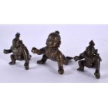 THREE 18TH/19TH CENTURY INDIAN BRONZE FIGURES OF ROAMING BUDDHA all modelled resting upon one leg.