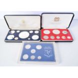 THREE CASED SILVER PROOF COIN SETS. (3)