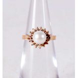 A 14CT GOLD PEARL AND DIAMOND RING. 2.5 grams. F.