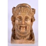 AN EARLY GREEK CARVED STONE MARBLE HEAD OF A GOD modelled as a bearded male. 21 cm x 12 cm.