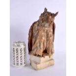 A LARGE 19TH CENTURY CONTINENTAL PORCELAIN FIGURE OF AN OWL modelled seated upon books. 25 cm x 11