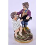 A 19TH CENTURY CONTINENTAL PORCELAIN FIGURE OF TWO BOYS modelled fighting over a hat. 18 cm x 10