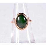 A 14CT GOLD AND JADE RING. 3.8 grams. K.