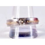 A 14CT GOLD SILVER AND DIAMOND RING. 7.9 grams. W.