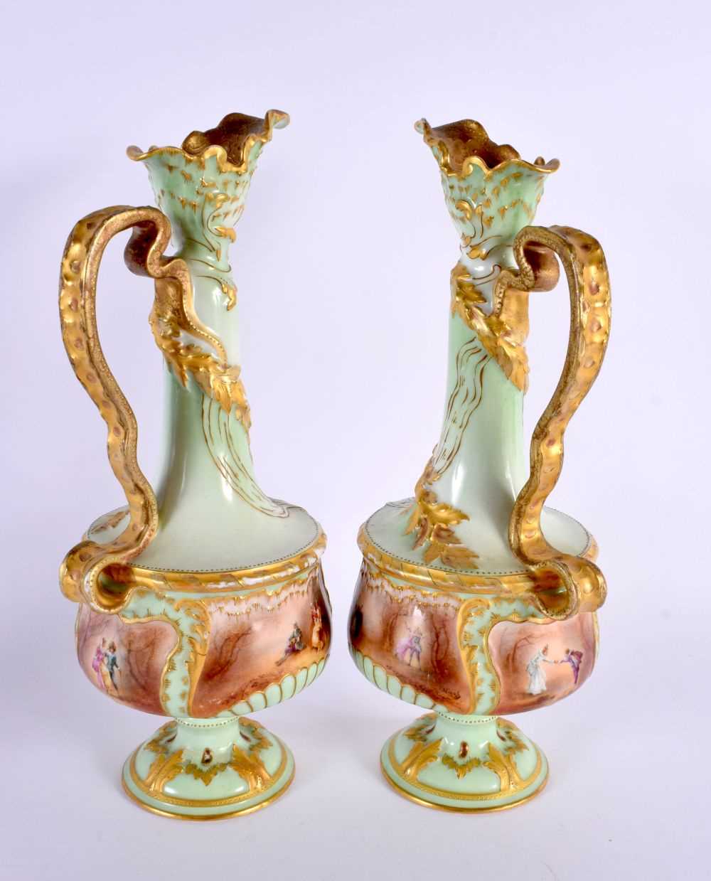 A PAIR OF ANTIQUE FRENCH LIMOGES PORCELAIN EWER painted with figures in a landscape upon a green - Image 3 of 6