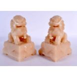 A PAIR OF EARLY 20TH CENTURY CHINESE CARVED SOAPSTONE DOGS OF FOE Late Qing/Republic. 18 cm x 10
