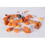 A group of amber beads, together with white metal items. (qty)