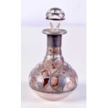 A SILVER OVERLAID SCENT BOTTLE. 9 cm high.