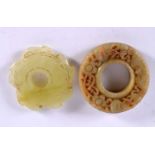 TWO CHINESE CARVED JADE ROUNDELS 20th Century. Largest 5 cm wide. (2)