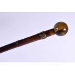 AN ANTIQUE TIGERS EYE WALKING CANE. 90 cm long.