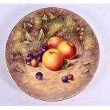 A ROYAL WORCESTER CABINET PLATE painted with fruit by H Ayrton. 25 cm diameter.