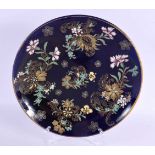 AN ART NOUVEAU FRENCH ENAMELLED BLUE PLATE painted with raised enamel foliage. 28 cm diameter.