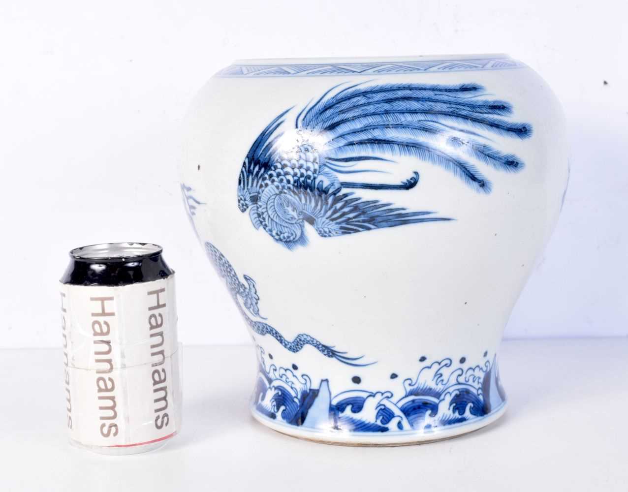 A large Chinese blue and white porcelain vase painted with mythical beasts over crashing waves. 24 x