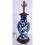 A 19TH CENTURY CHINESE BLUE AND WHITE PORCELAIN LAMP painted with flowers. 50 cm high.