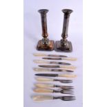 ART DECO SILVER AND MOTHER OF PEARL FLATWARE together with a pair of candlesticks. Flatware