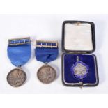 A PAIR OF HMS WORCESTER & CONWAY SILVER BOAT RACE MEDALS together with a silver and enamel