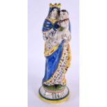 A 19TH CENTURY FRENCH FAIENCE SAINT MARIE POTTERY FIGURE. 24 cm high.