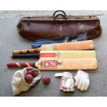 A vintage cricket bag,bats,ball and gloves (6).