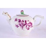 AN 18TH CENTURY GERMAN PORCELAIN TEAPOT AND COVER painted with puce flowers. 17 cm wide.