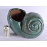 A LARGE AND UNUSUAL GREEN GLAZED POTTERY NAUTILLUS SHELL PLANTER of naturalistic form. 40 cm x 27