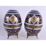 A PAIR OF EARLY 20TH CENTURY FRENCH BRONZE AND PORCELAIN EGGS probably Limoges in the Sevres